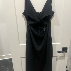 New with tags! Lulus midi black dress. Cut out in front!
